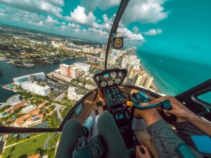 People in a helicopter flying above Miami.